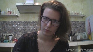 Solo girl with glasses chatting in the kitchen