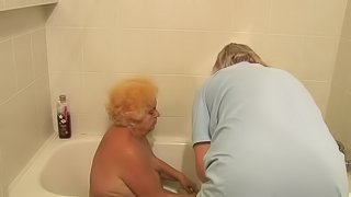 Horny grannies share a guy's hard cock in a hot threesome