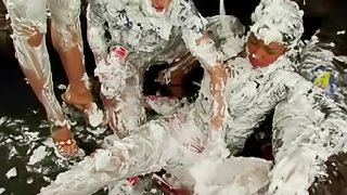 Two babes get messy when they have a whipped cream fight